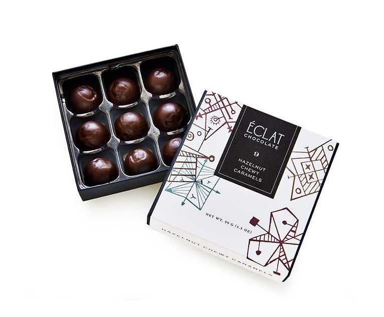 Box of chocolate truffles with Eclat Chocolate packaging on a white background